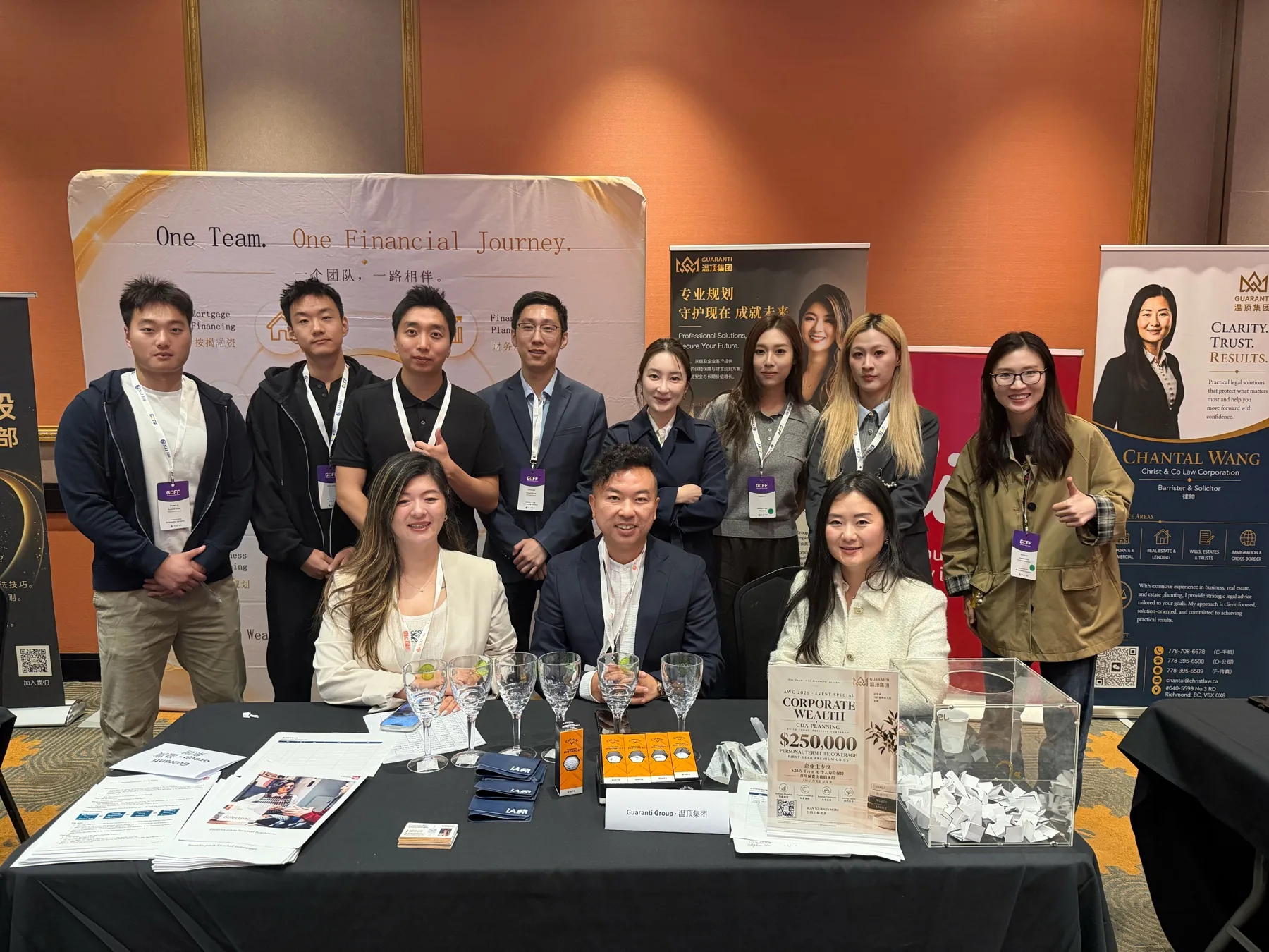 Guaranti team members together at the branded booth
