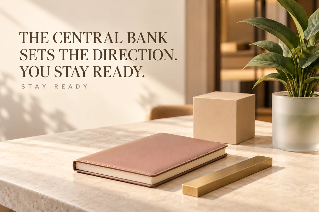 Notebook and household still life invite readers to review their finances ahead of a rate decision