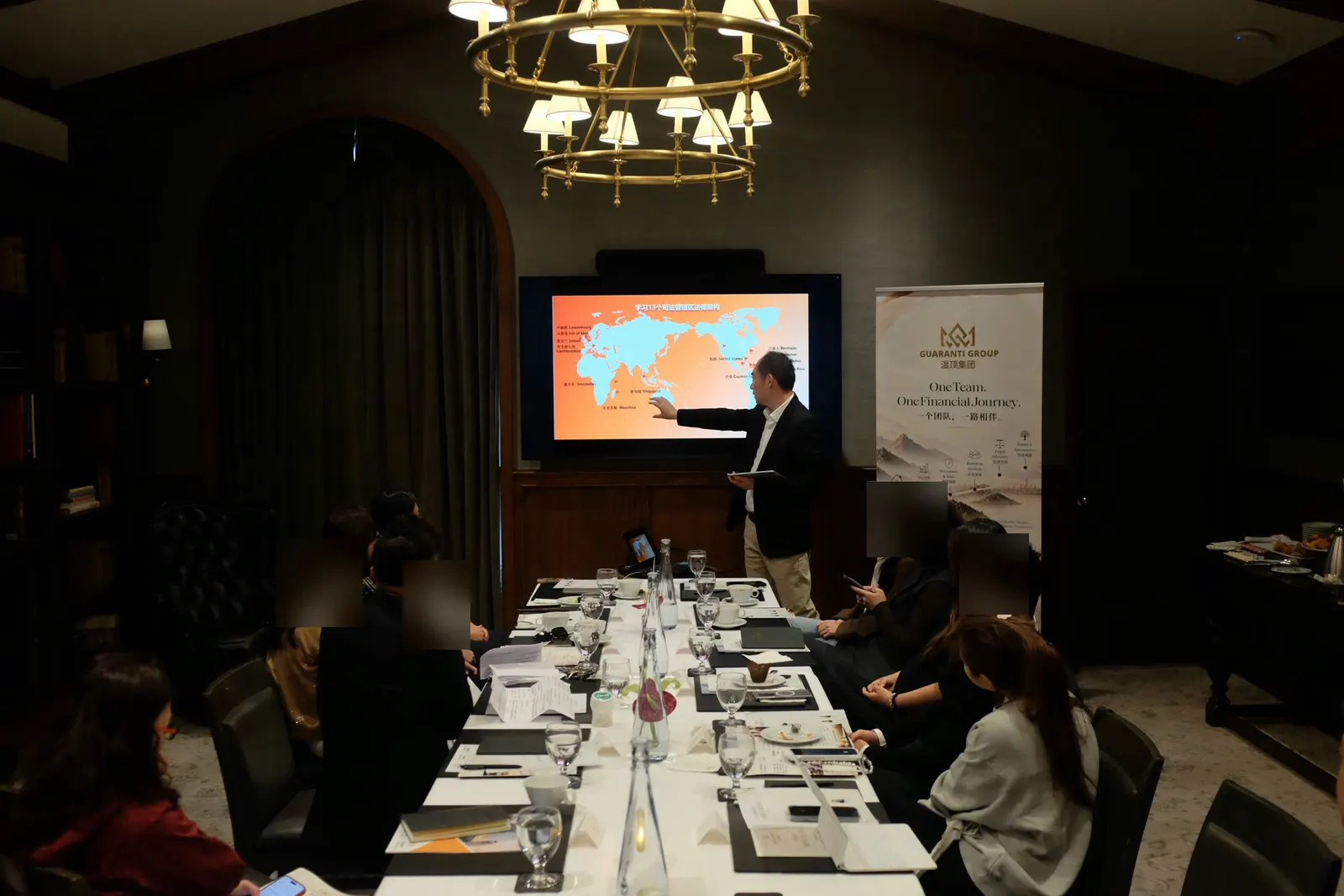 Spacer Fang presents on cross-border wealth topics; an attendee’s profile has been blurred for privacy