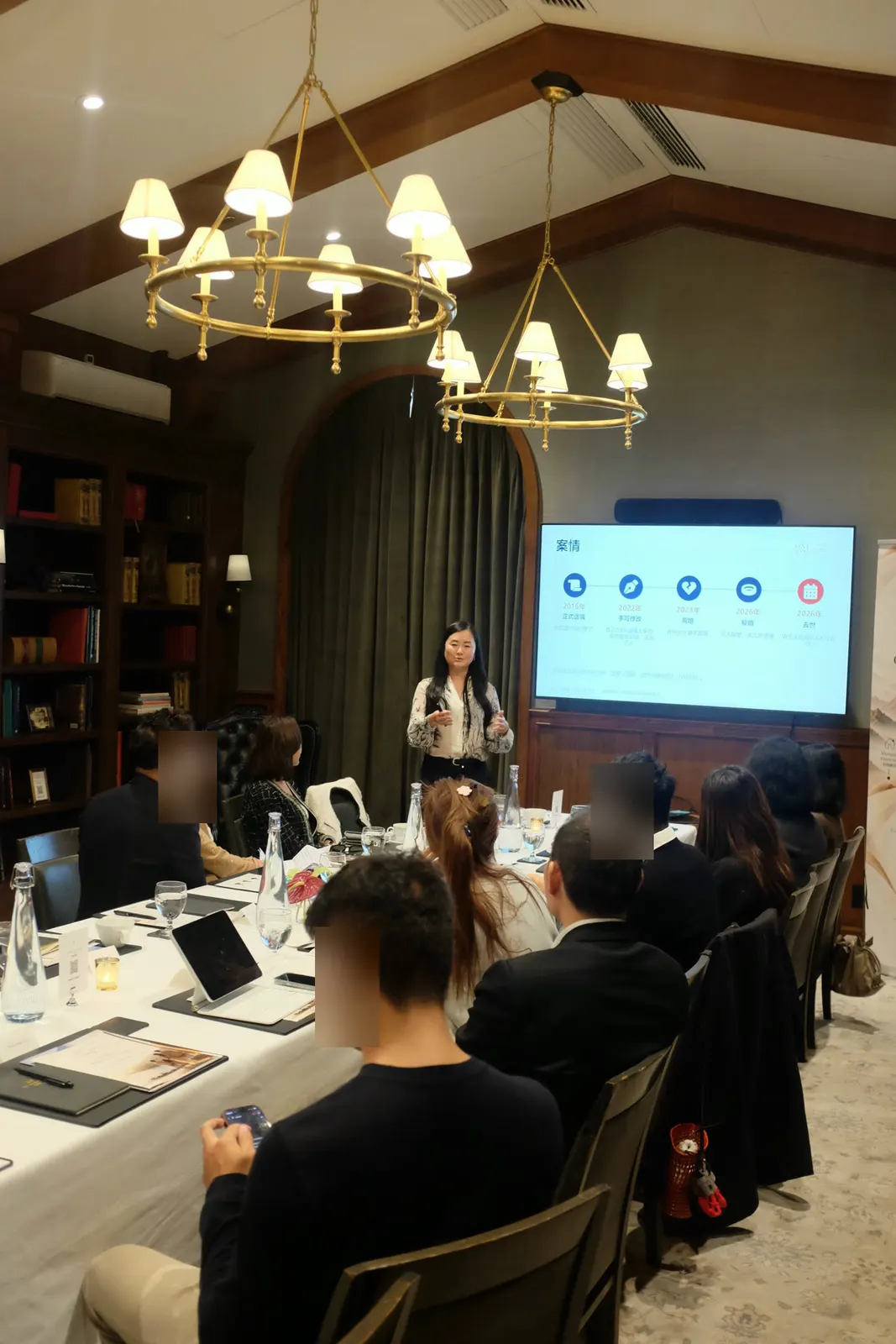 Lawyer Chantal Wang presents on legal structures and asset protection; some details have been blurred for privacy