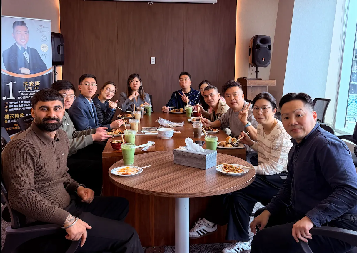 Guaranti team enjoying lunch around a table