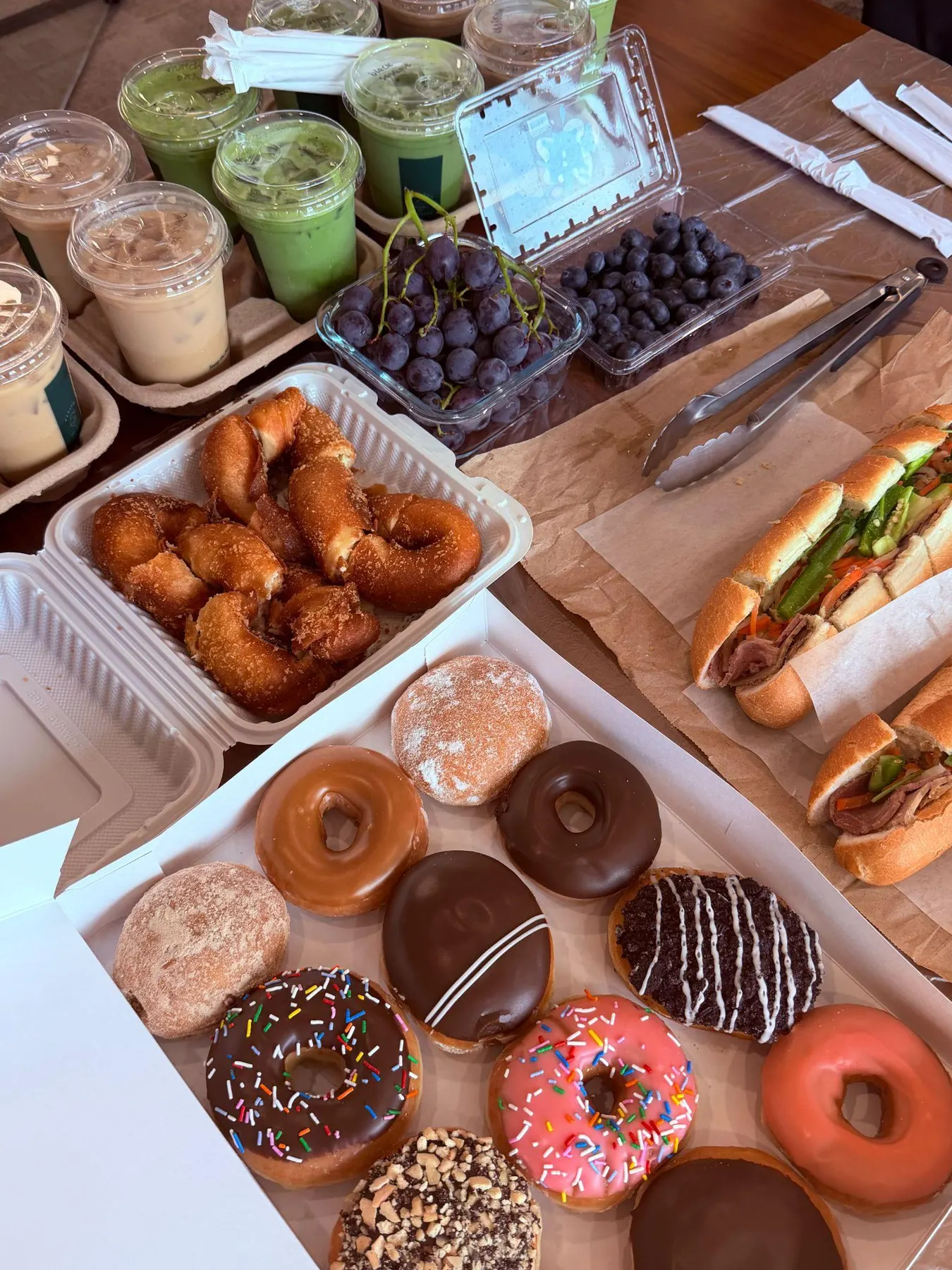 Drinks, pastries and sandwiches brought to the potluck