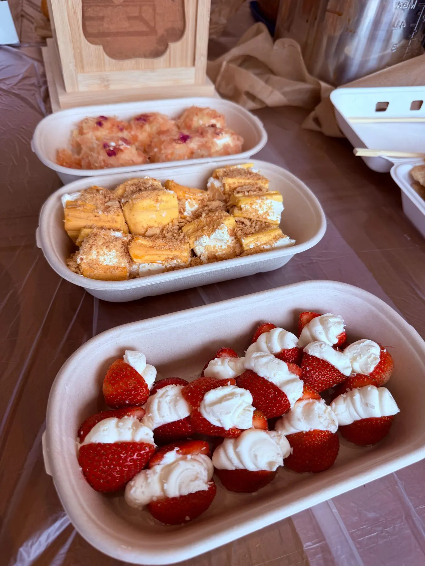 Strawberries and desserts on the potluck table